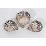 Trio of Elizabeth II silver dishes of shell form, raised on ball feet, (London 1972, 1973 & 1975), m