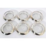 Set of six American silver mounted glass coasters, stamped 'Webster's Sterling', each 10cm in diamet