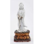 Chinese blanc de chine figure of Guanyin, Qing period, mounted on a gilt wood double lotus base, 27.