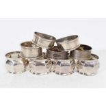 Set of four George V silver napkin rings with faceted decoration (Birmingham 1918), together with fi