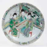 Chinese famille verte dish, Kangxi period, decorated with three female figures seated on stools by a