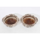 Pair of 19th century Old Sheffield Plate wine coasters with fluted decoration, shell, scroll and aca