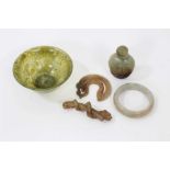 Small collection of Chinese jade, including a spinach jade bowl, a snuff bottle, a bangle, a toggle