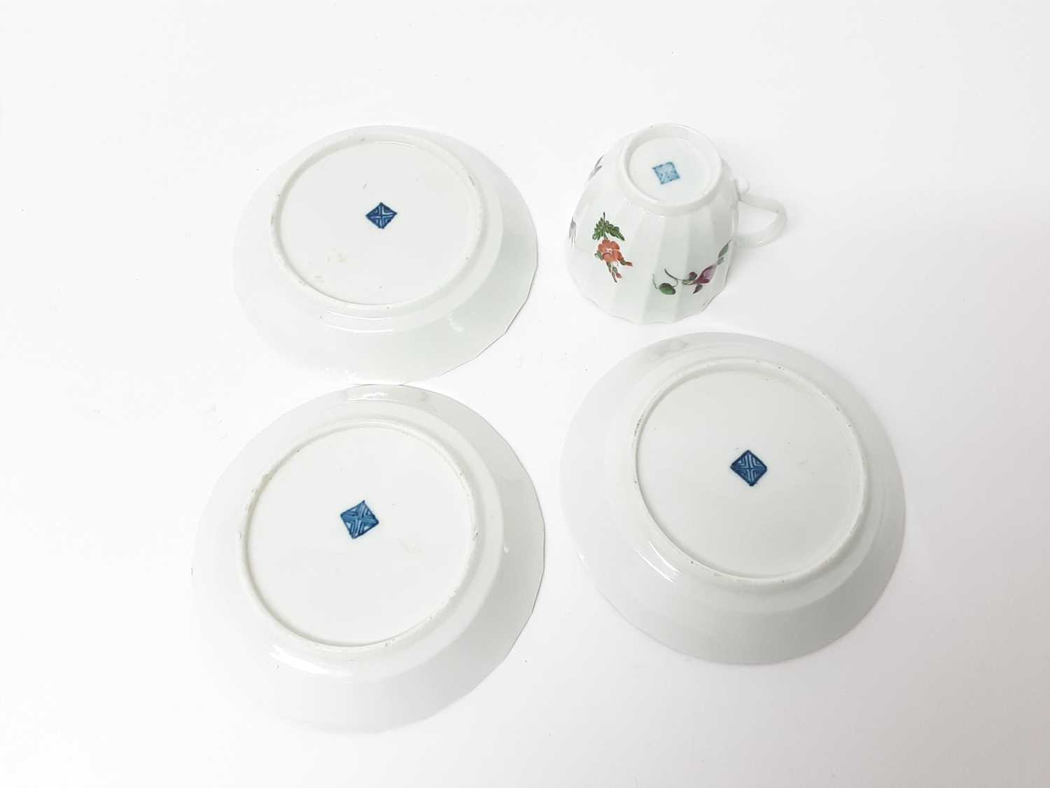 A Worcester flower painted faceted coffee cup and three saucers, circa 1770 - Image 3 of 3