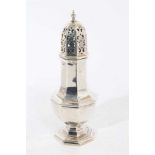 George V silver sugar caster of faceted octagonal form with pieced slip in cover, on octagonal foot,
