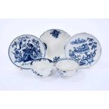 Lowestoft tea bowls and saucers, including a tea bowl painted in blue with trailing flowers, another