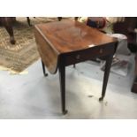George III mahogany oval pembroke table with two flaps and end drawer opening to 105 x 77 cm