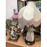 Two Capodimonte lamps and a further figure