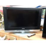 Panasonic flatscreen television model number TX-32LXD500 with remote control