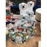 Two pairs of Staffordshire pottery spaniels, and a pair of Staffordshire clock groups (6)