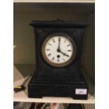 Early 20th century black slate mantel clock with white enamel dial