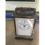 Brass Carriage clock with white enamel dial