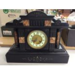 Early 20th century mantle clock inset with marble panels and columns