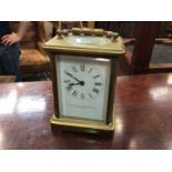 Brass cased carriage clock, the white enamel dial signed Webster & Co. & Jenner & Knewstub