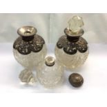 Group of silver mounted scent bottles and silver and tortoiseshell brushes and mirrors