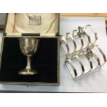 Pair of silver toast racks and cased silver egg cup