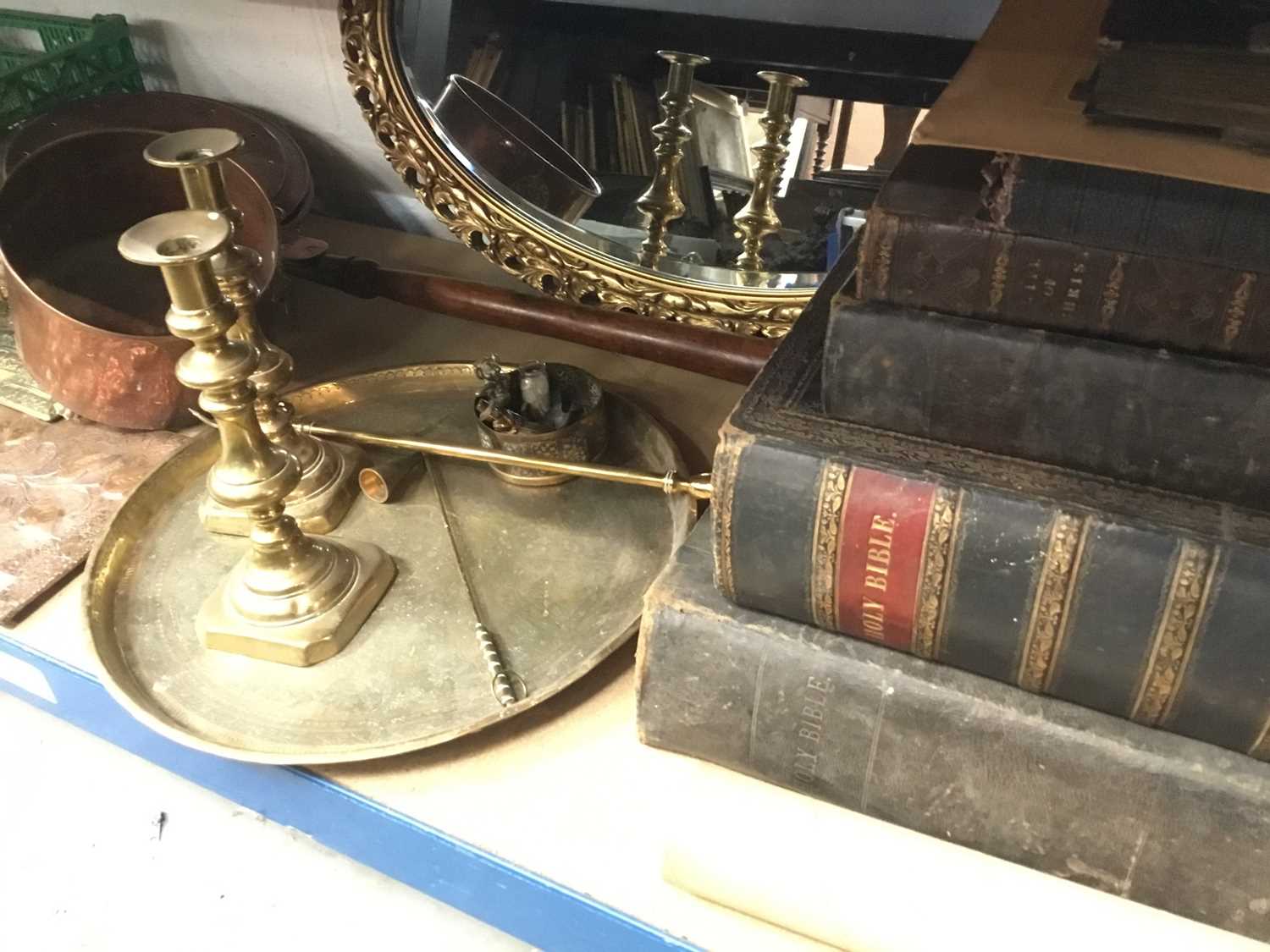 Antique Bibles, Victorian brass candlesticks, copper bed warmer, metalwork and sundries