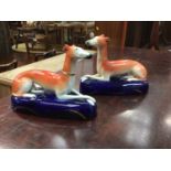 Pair of Victorian Staffordshire greyhound inkwells, 16.5cm across