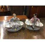 Pair of 19th century Meissen porcelain baskets with figure mounts, blue crossed swords and impressed
