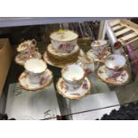 Hammersley 10 place setting teaset with floral and gilt decoration