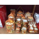 Group cottage ware to include storage jars, tea pot, jug, toast rack, egg cups etc