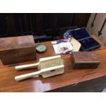 Dressing table items, including a pair of ivory brushes, three boxes, a pocket calendar and embroide