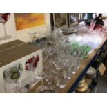Large collection of glassware, including drinking glasses, bowls, dishes, etc