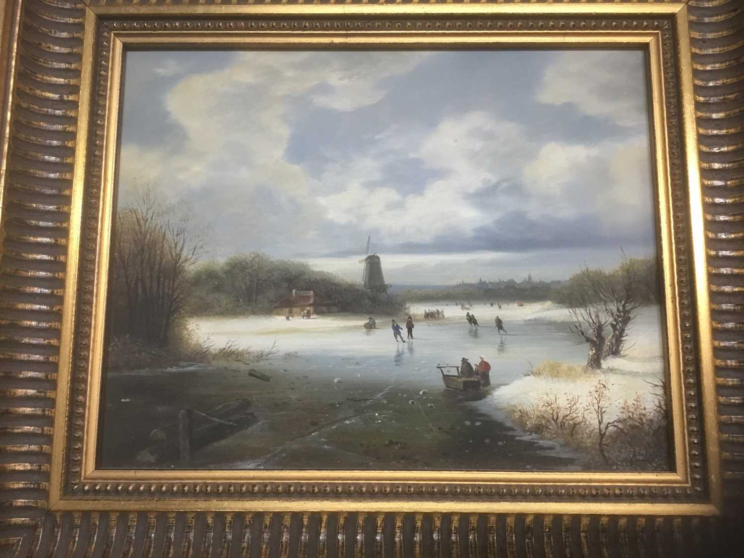 P. Rush, 20th century, oil on panel - Dutch winter landscape with figures on a frozen lake, signed,