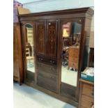 Edwardian inlaid mahogany wardrobe with two central panelled doors and four draws below flanked by t