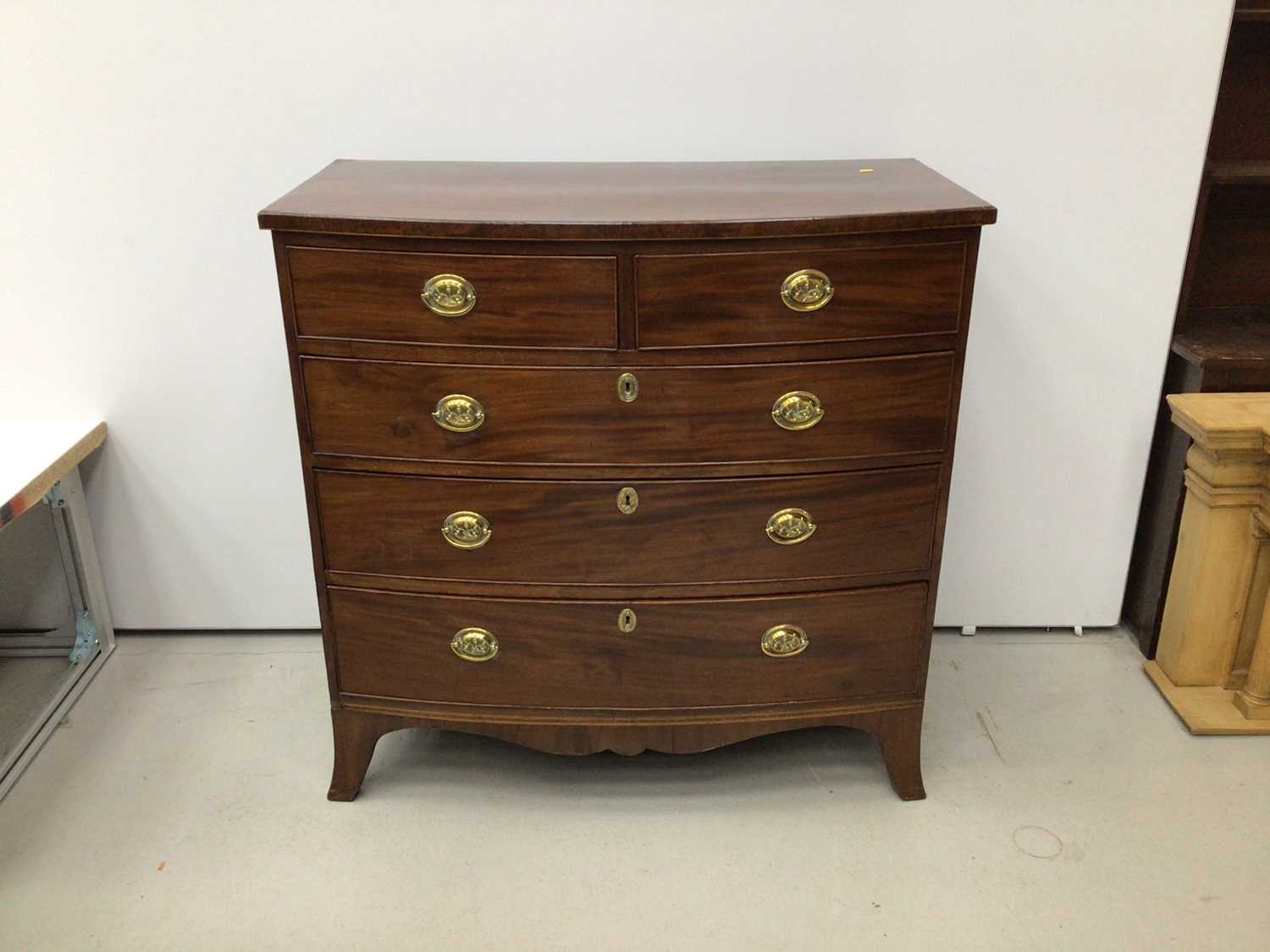 19th century inlaid mahogany bowfront chest of two short and three long graduated drawers on splayed