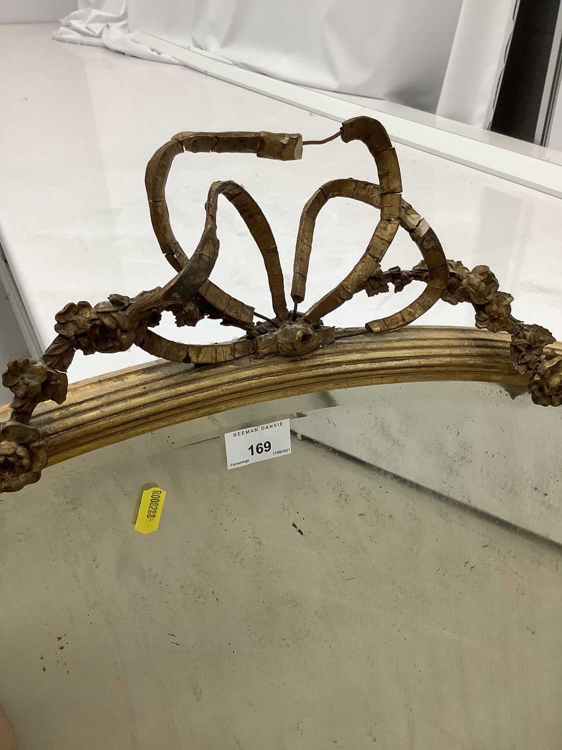 Oval wall mirror in ornate gilt frame with ribbon and swag decoration, 100cm x 77cm - Image 4 of 4