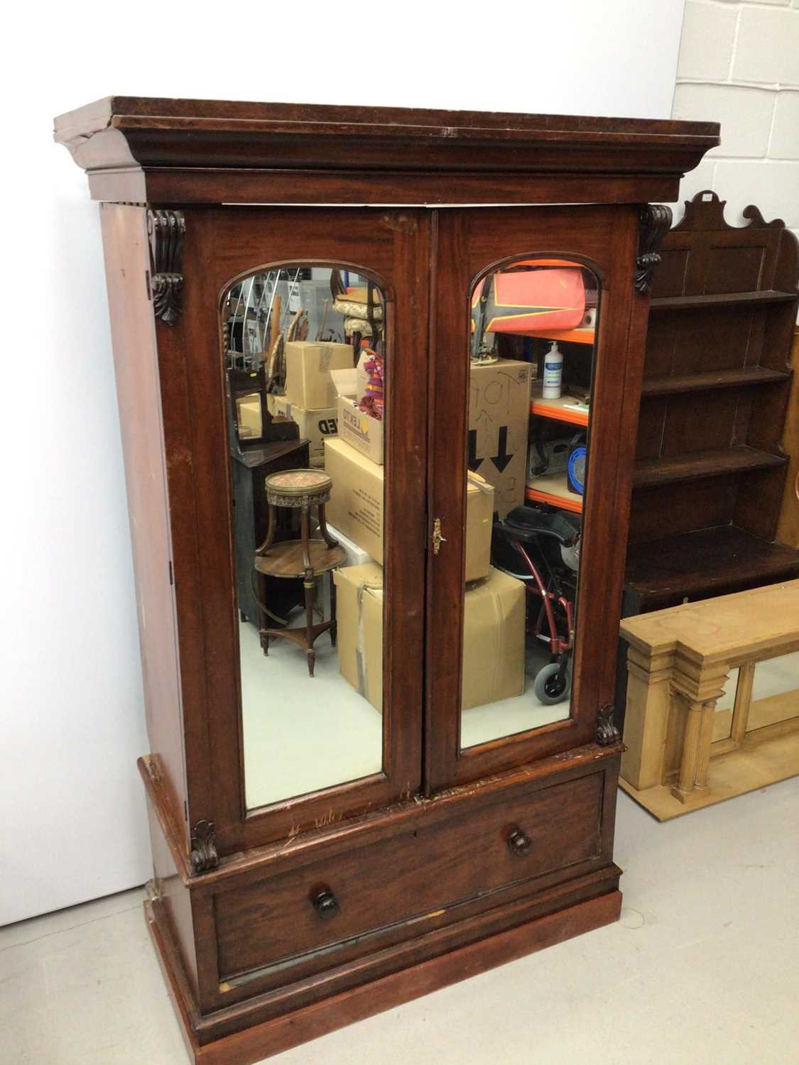 Victorian mahogany double wardrobe with two arched mirror doors and drawer below, 127cm wide x 57cm