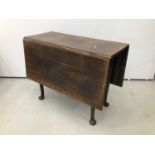 18th century oak drop leaf side table on pad feet, together with a Victorian oak centre table