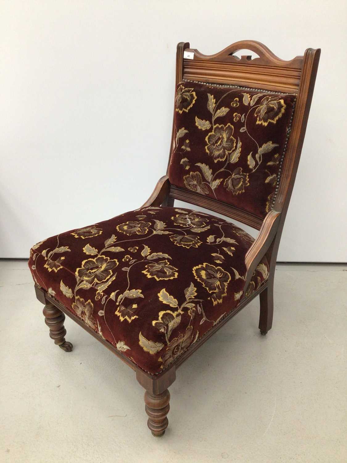 Edwardian walnut framed easy chair with upholstered seat and back on turned front legs and castors - Image 5 of 5