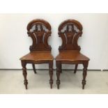 Pair of early Victorian mahogany hall chairs