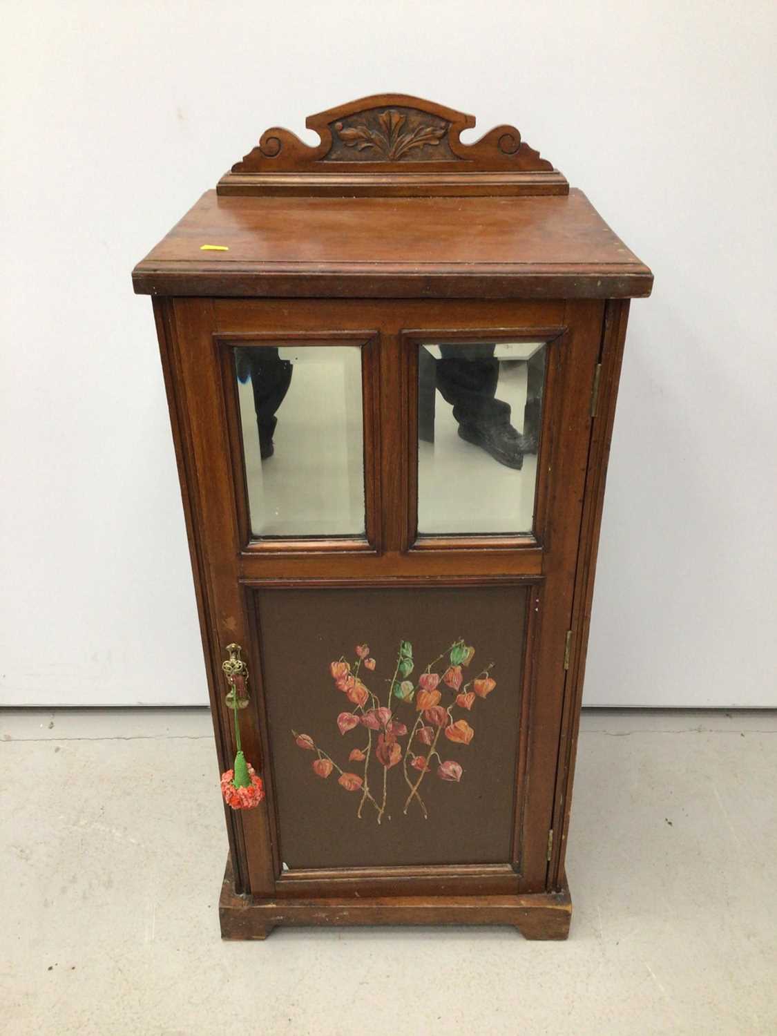 Edwardian walnut pot cupboard with ledge back, two bevelled mirror plates and painted door below, 45