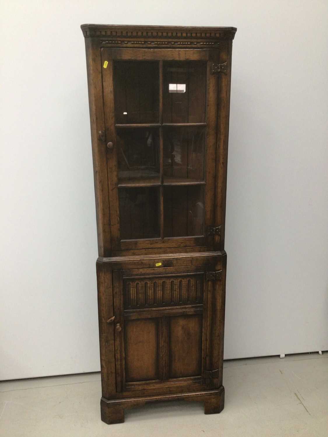 Antique style oak two height corner cupboard with glazed door above and panel door below 61cm wide x