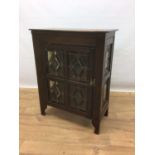 Early 20th century cabinet with shelved interior enclosed by stained and leaded glazed door, 68cm wi