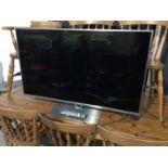 Panasonic flatscreen television model number TX-L47FT60B with remote control