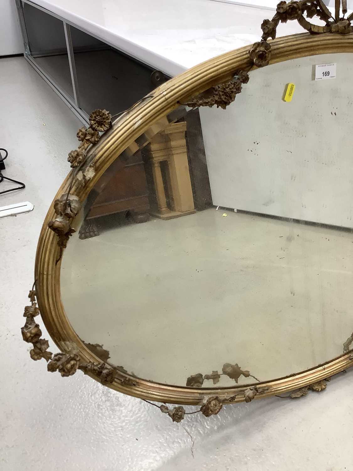 Oval wall mirror in ornate gilt frame with ribbon and swag decoration, 100cm x 77cm - Image 3 of 4