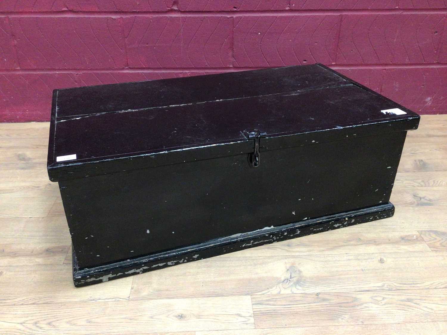 Victorian black painted pine trunk, brass fender and trivet