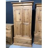 Modern pine double wardrobe with two panelled doors and drawer below, 97.5cm wide x 63cm deep x 208.