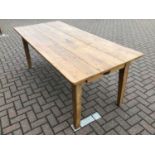 Pine dining table on square legs 198cm wide x 88cm deep x 77cm high with a set of eight pine chapel