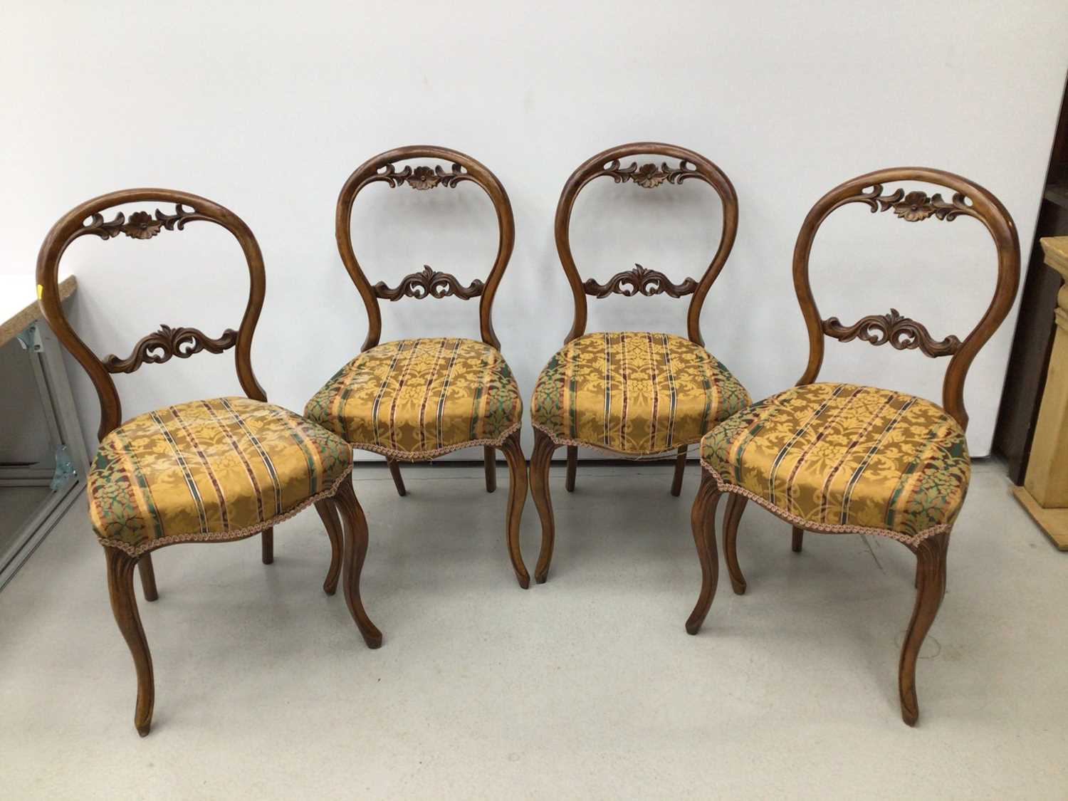 Set of four Victorian walnut balloon back chairs