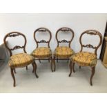 Set of four Victorian walnut balloon back chairs