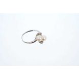 Cultured pearl and diamond cross-over ring