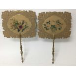 Pair of early 19th century face screens, each with turned giltwood handle