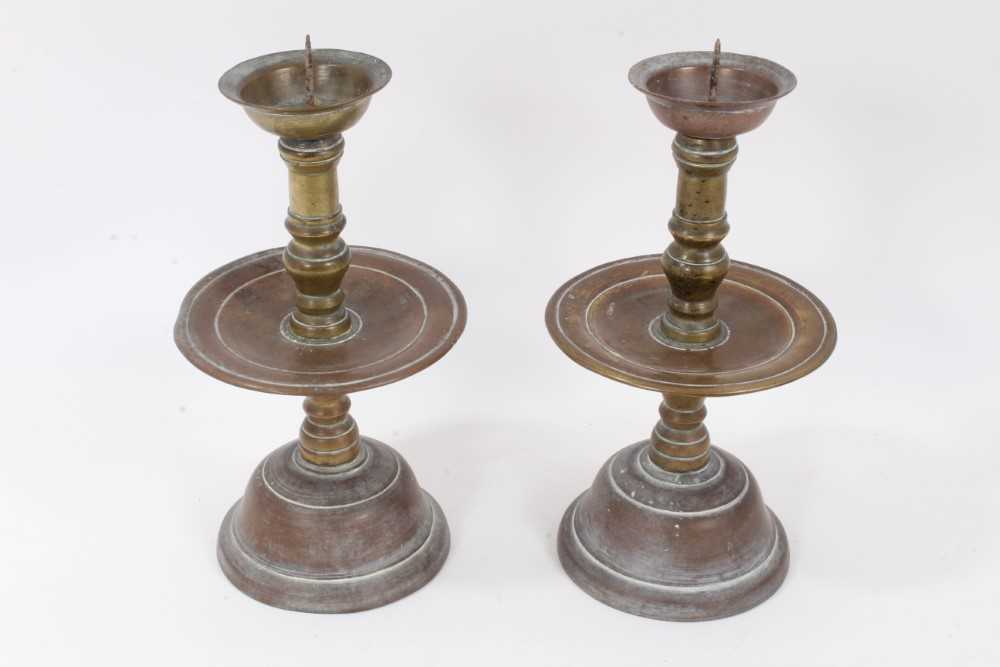 A pair of 17th / 18th century Dutch bronze pricket candlesticks