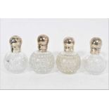 Two pairs of silver mounted glass perfume bottles of globular form