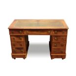 Victorian mahogany twin pedestal desk, the rounded rectangular moulded top with inset tooled leather